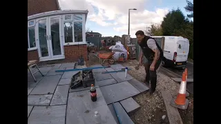 Time-lapse makeover video installing Indian sandstone paving.