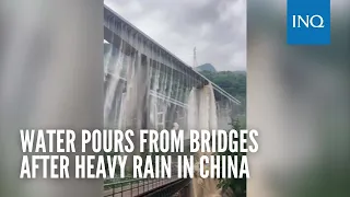 Water pours from bridges after heavy rain in China