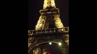 Eiffel Tower Paris lights switching on.