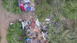 Large homeless encampment across from Plaza Bonita Mall