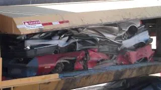 cars being crushed in crusher