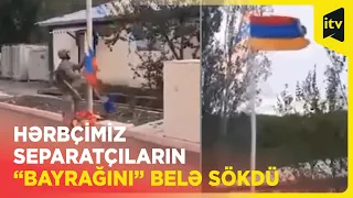 Hərbçimiz nəzarət altına alınan erməni bazasında separatçıların əski parçasını endirib