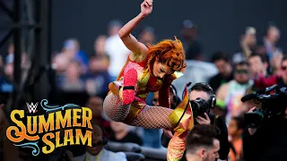 Lynch delivers a leg drop to Belair on the barricade: SummerSlam 2022 (WWE Network Exclusive)