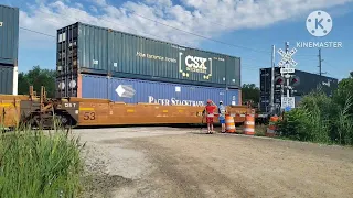 CSX I151 And CSX M510 Roll Through The Judd Road Railroad Crossing, New Boston, MI.