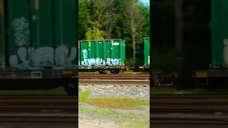 Fast Amtrak Train Speeds Past CSX Freight Train