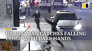 Heroic man catches falling child with bare hands