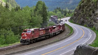 Train Follows Curvature Of Highway Thru Canadas Canyon, CP SD70ACU Rebuild In Action!