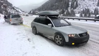 Allroad pulls Pathfinder out of snow bank.