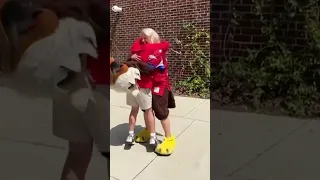 Mom dressed as mascot surprises son after military deployment.