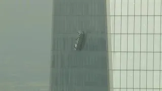 Workers on dangling World Trade Center scaffolding