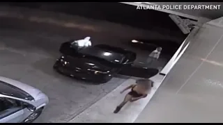 Woman fights off armed carjackers