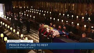 Prince Philip is laid to rest as somber queen sits alone as crowds line streets to pay respects