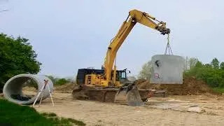 Epic Excavator Action: Moving Concrete Culverts with Precision #construction  #komatsu