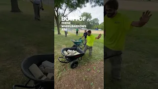 A ONE HANDED uphill wheelbarrow challenge.