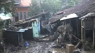 Dozen dead and missing in Indonesian landslides, floods