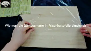 Wie man die Bambusmatte in Frischhaltefolie einwickelt