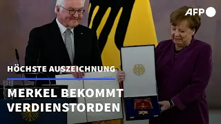 Steinmeier würdigt Verdienste Merkels bei Ordensverleihung | AFP