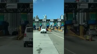 Bird’s eye view of the city of Panama in the country of Panama. Driving to the city on main highway.