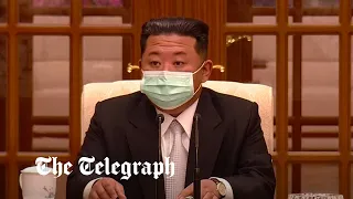 Kim Jong Un wears mask on state TV for the first time as sudden lockdown ordered in North Korea