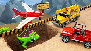 Rescue cars, cranes rescue cars and dinosaur planes from sand pits