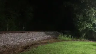 Very fast csx freight train at night