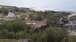 Powerful landslide sweeps eight houses into the sea in the Norway.