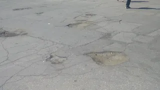 Разбитая дорога ямы улица Советская город Бендеры