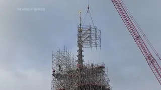 Removal of scaffolding enshrouding the summit of Paris' Notre Dame Cathedral gets underway