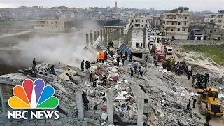 Drone footage shows rescuers dig through mountain of rubble in northern Syria