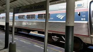 Amtrak screeches brakes as it passes station.