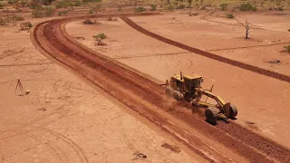 Building waterponds with a road grader.