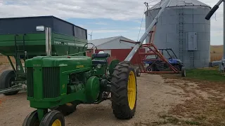 John Deere 70 on the auger