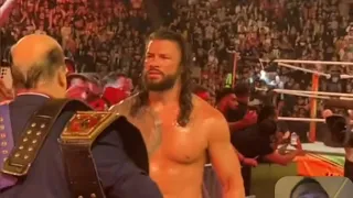 An emotional roman reigns leaving with paul heyman after losing to the usos at WWE money in the bank