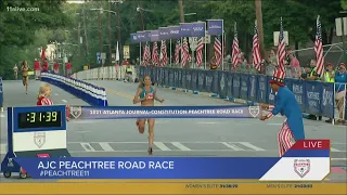 Sara Hall crosses the finish line for the women's elite race