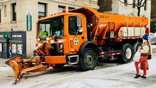 DSNY SPREADER PLOWING AND SALTING DURING WINTER STORM VIOLA ON WEST 117TH STREET IN MANHATTAN, NYC.