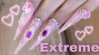 Stunning stiletto nails with 4D flowers and bling