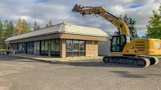 Entire strip mall absolutely demolished by an excavator