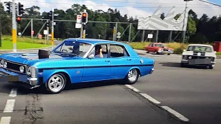 Fast cars sending it, at car meet exit