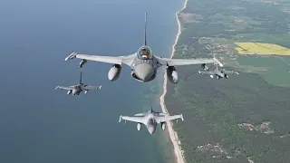 Portuguese and Romanian jets assigned to Baltic Air Policing fly over Lithuania