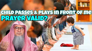 My child passes & plays in front of me while I'm praying, is my prayer valid? #assim assim al hakeem