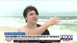 Red and purple flags warn Orange Beach visitors of jellyfish and rip currents