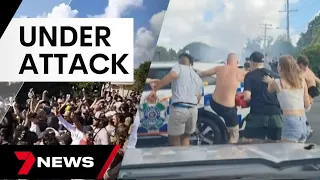 Police attacked as hundreds attend out-of-control meet-up in Logan | 7 News Australia