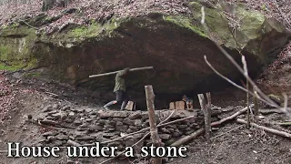 The beginning of the construction of the house under the stone. Part 1