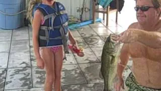 Little girl catches 16" bass on a Barbie pole