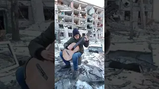 Ukrainian song "My native mother" in destroyed Kharkiv, Ukraine. Українська пісня. Рідна мати моя