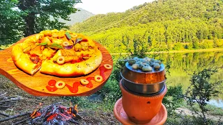 cooking Campfire pizza in the claye oven in forest.#veganpizza #villagefood