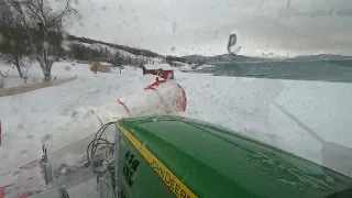 Almost closed road, plowing snow after a storm.