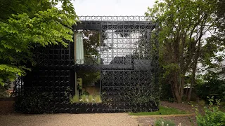 Sculptural steel screen invites nature to grow around Woven House in Kent