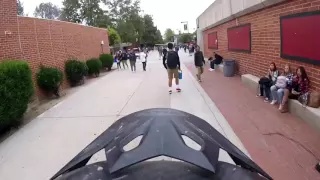 Man rides motorcycle through Hart High School