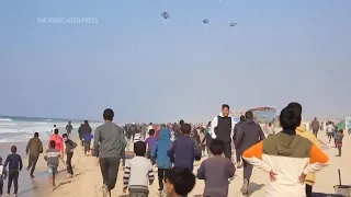 Hundreds gather in the beach southern Gaza Strip trying to get aid airdropped in the enclave